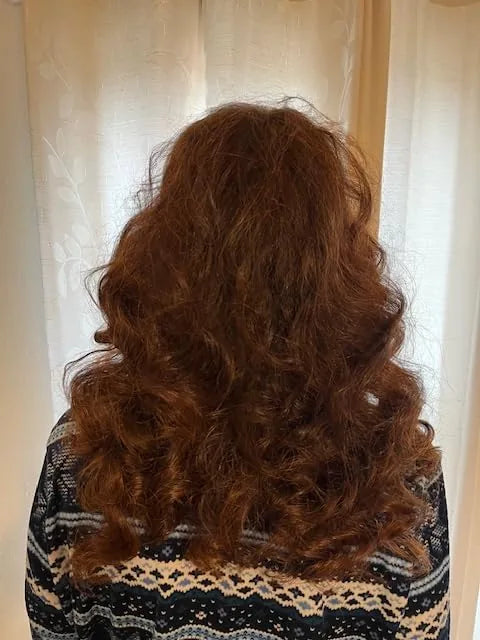 Customer photo showing a finished hairstyle
